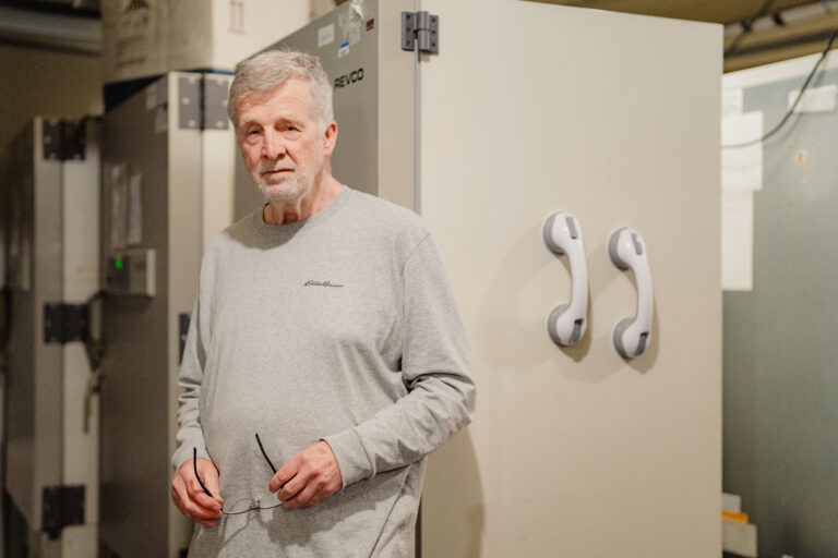 Pieter De Jong poses for a portrait in front of freezers containing DNA samples at his home on Wednesday, July 3, 2024, in Redmond, Wash