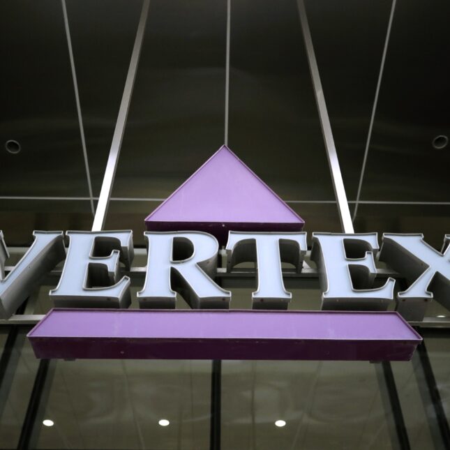 Vertex Pharmaceuticals logo sign displayed outside the building facade — coverage from STAT