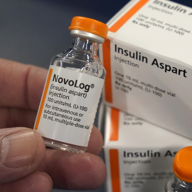 A file photograph close up of a person holding a vile of NovoLog insulin made by NovoNordisk