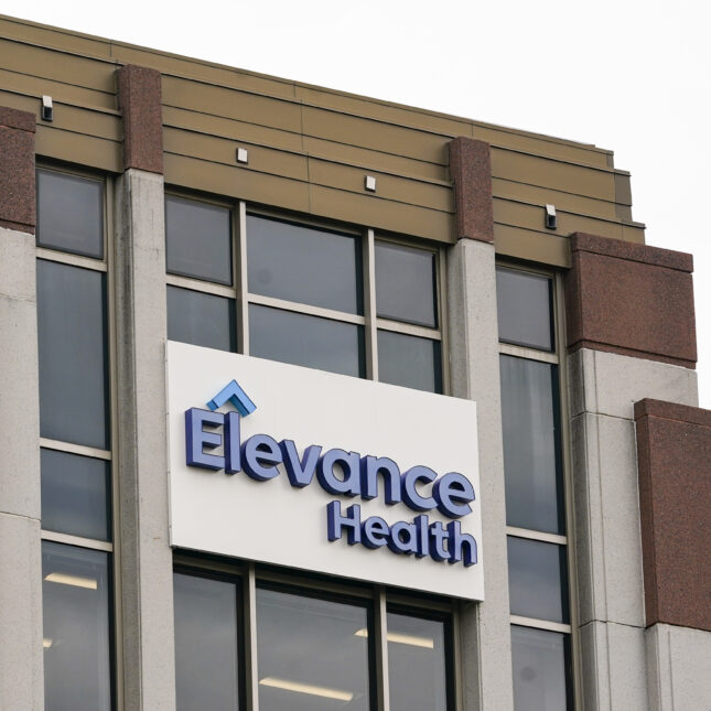 A sign of Elevance Health on headquarter building's glass exterior — business coverage from STAT