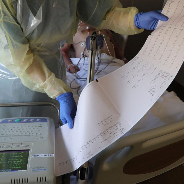 File news photo of a A nurse checking an electrocardiogram performed on a patient