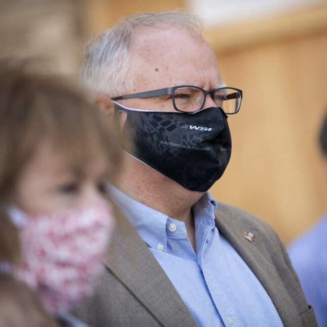 File news photograph close up of Sen. Tina Smith (D-MN) and Minnesota Governor Tim Walz both wearing masks in June 2020