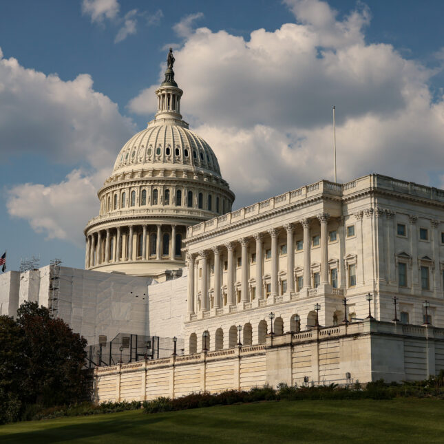 The Capitol building, including the lawn outside, under cloudy blue sky — first opinion coverage from STAT