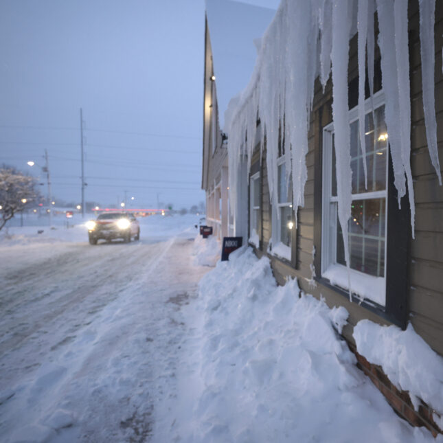 street level file photograph of a street covered in ice and snow in Iowa